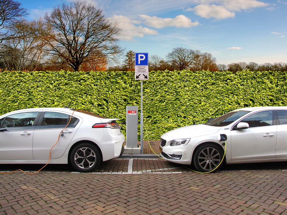 two electric cars charging