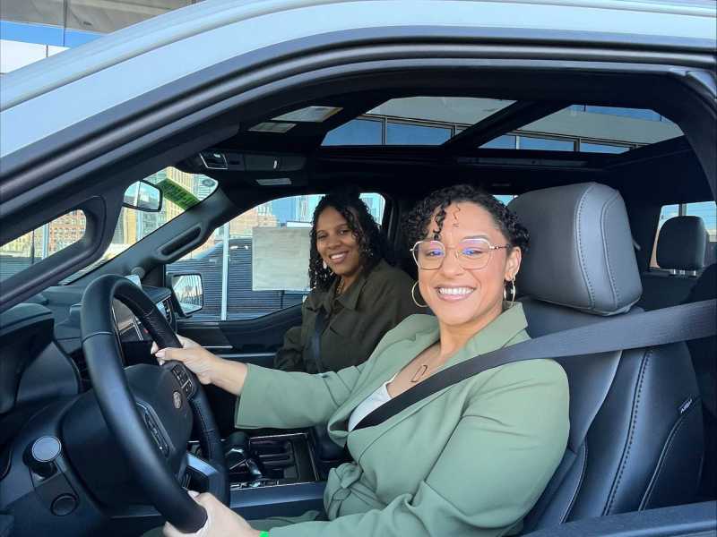 Woman driving electric vehicle